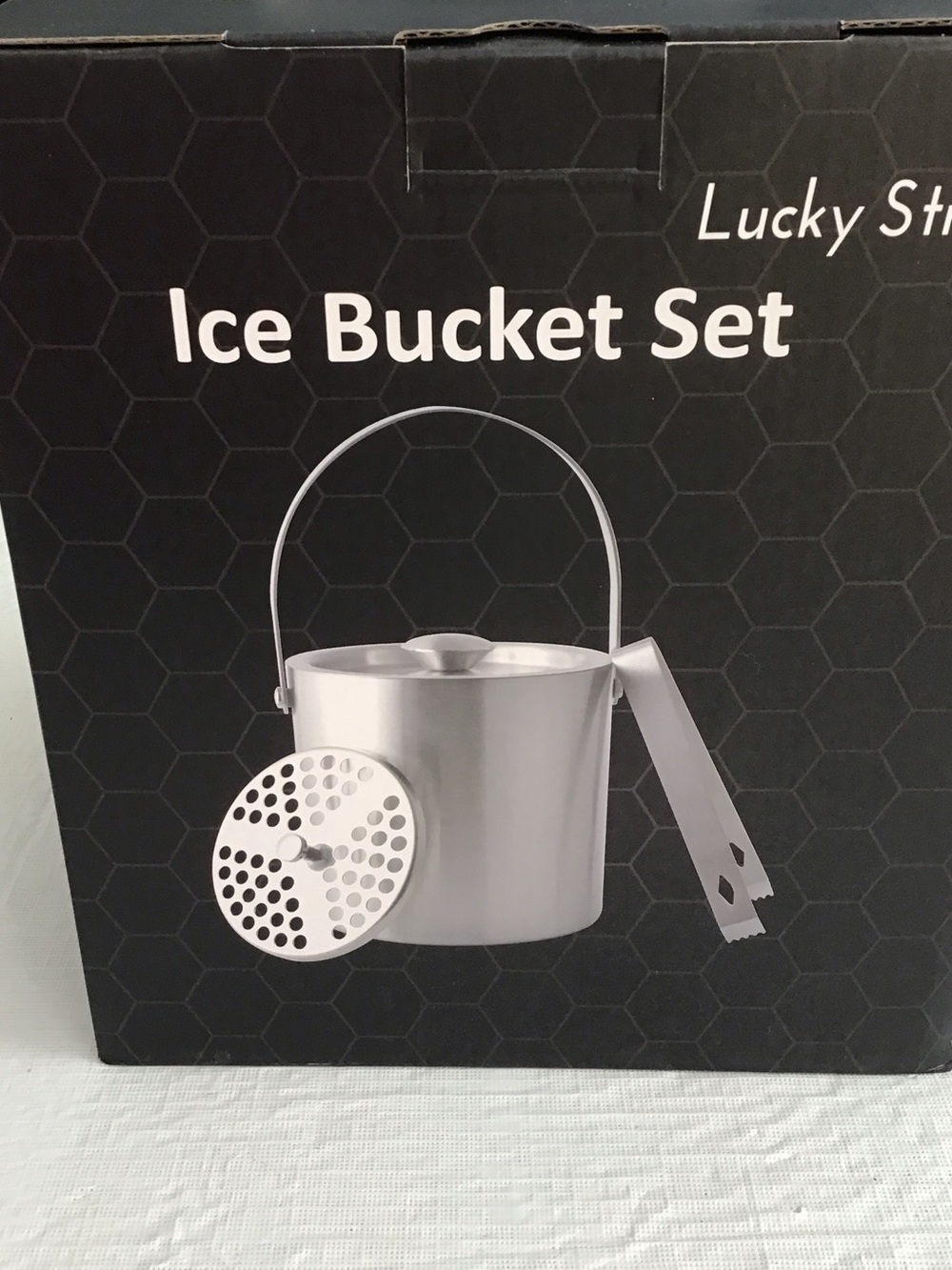 Ice Bucket includes Strainer, and tongs. ##